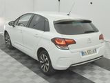 a picture of a white car parked in a garage