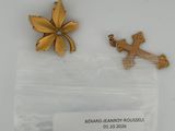 two pieces of jewelry are sitting in a bag on a table