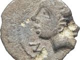 une pièce de monnaie ancienne représentant la tête d'un homme et d'une femme