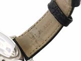 a close up of a wrist watch with a leather band