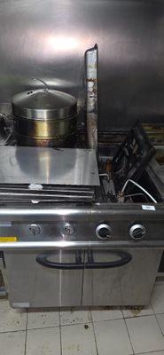 a pot on the stove in the kitchen next to the oven