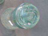 a close up of a glass bottle on a table