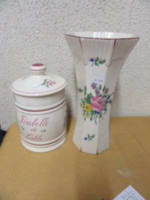 two vases on a table next to each other