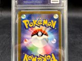 a close up of a pokemon card in a clear plastic case