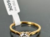 a close up of a diamond ring on a table with a price tag