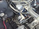 a picture of a car engine with its hood open