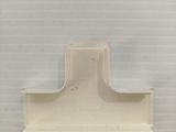 a picture of a white shelf with a clock on it