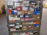 a metal cart with many boxes on it in a warehouse