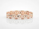 une pile de trois bracelets en or rose et diamants