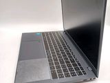 a laptop that is sitting on a white table