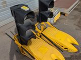 two yellow kayaks sitting next to a traffic light