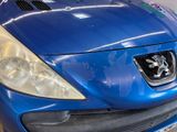 a blue car that is parked in a garage