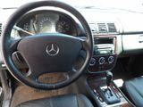 a steering wheel and dashboard of a car in a car showroom