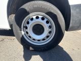 a white truck that has a flat tire on it