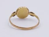 an image of a gold ring with a round stone in the middle
