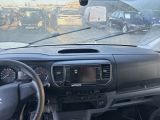 a dashboard view of a car with a lot of cars in the background