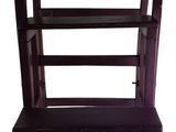 an image of a wooden shelf with three shelves on it