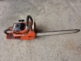 a chainsaw that is sitting on the ground
