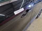 a car with a sticker on the side of it ' s door