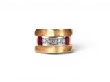 a close up of a gold ring with diamonds on a white background