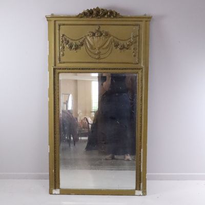 a mirror that is sitting on the floor in a room