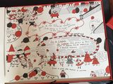 an open book with a drawing on it on a table
