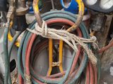 many hoses that are sitting on the floor next to each other