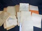 several old papers are stacked on top of each other