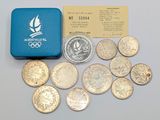 a box of coins sitting next to a small box of coins