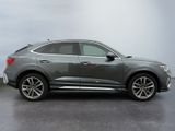 the new audi qx suv is parked in the garage
