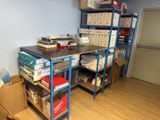 a desk with a lot of boxes on it in a room