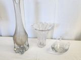 two vases on the table and a glass vase on the table