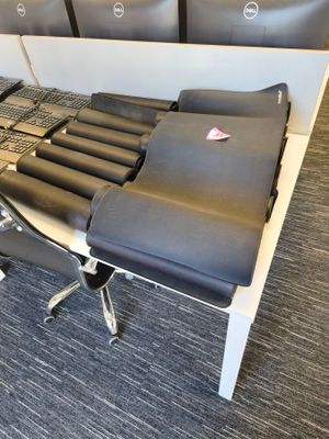 a desk with a chair and a computer on it