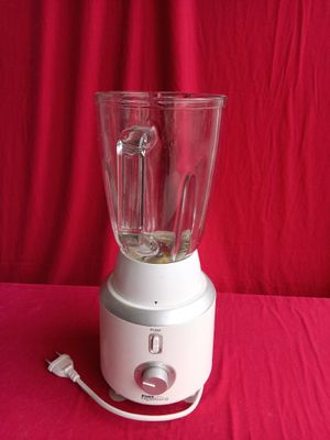 a blender that is sitting on a red table