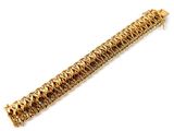 a close up of a gold bracelet on a white background