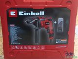 a close up of a red box with a drill in it
