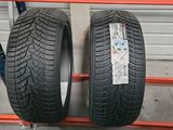 a pair of tires on a rack in a warehouse