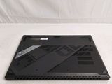 a laptop that is sitting on a white surface