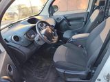 the interior of a small car with a steering wheel and a dashboard
