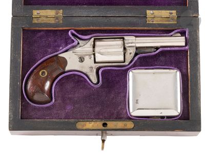 an old gun in a wooden case with a purple lining