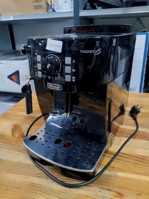 a coffee machine that is sitting on a wooden table