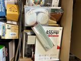 a cardboard box filled with assorted items in a room