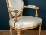 an image of a white chair sitting on top of a hard wood floor