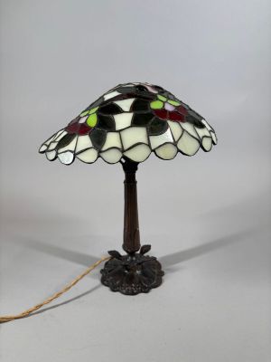 a close up of a lamp on a table with a white background