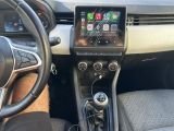 the interior of a car with a steering wheel, dashboard, and display screen