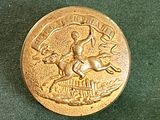 une pièce d'or sur laquelle figure un homme à cheval