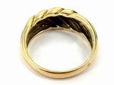 an image of a close up of a gold ring on a white surface