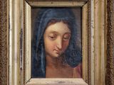 une image représentant un tableau d'une femme portant un voile sur la tête