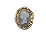 a close up of a ring with a picture of a woman on it