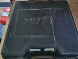 a black case sitting on top of a wooden table